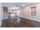 Open-concept living space with hardwood flooring and staircase leading to the upper level at 1555 New Ne St, Atlanta, GA 30307