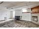 Basement space with a fireplace, white brick walls, and plenty of room for storage or activities at 1798 Melrose Sw Dr, Atlanta, GA 30310