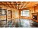 Unique bonus room with wood paneling, fireplace, and eye-catching checkered floor at 1798 Melrose Sw Dr, Atlanta, GA 30310