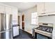 Well-lit kitchen with stainless steel appliances and sleek, modern design elements at 1798 Melrose Sw Dr, Atlanta, GA 30310