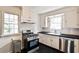 Efficient kitchen featuring stainless steel appliances, white cabinetry, and ample counter space at 1798 Melrose Sw Dr, Atlanta, GA 30310