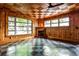Cozy living room with wood paneled walls, decorative ceilings, fireplace, and unique tile floor at 1798 Melrose Sw Dr, Atlanta, GA 30310