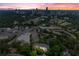 Aerial view featuring city skyline at dusk at 3636 Habersham Nw Rd # 2101, Atlanta, GA 30305