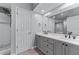Bathroom with double vanity sinks, a large mirror, and a separate glass-enclosed shower at 3636 Habersham Nw Rd # 2101, Atlanta, GA 30305