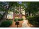 A charming exterior of a brick apartment building with balconies and manicured landscaping at 3636 Habersham Nw Rd # 2101, Atlanta, GA 30305