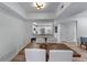 Dining area adjacent to the kitchen, featuring hardwood floors and ample natural light at 3636 Habersham Nw Rd # 2101, Atlanta, GA 30305
