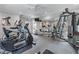 Community gym featuring treadmills, elliptical, weights, television, ceiling fan, and mirrored wall at 3636 Habersham Nw Rd # 2101, Atlanta, GA 30305