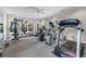 Community gym featuring treadmills, elliptical, weights, ceiling fan, and large windows at 3636 Habersham Nw Rd # 2101, Atlanta, GA 30305