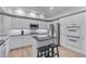 Updated kitchen features stainless appliances, granite counters, island with seating and white cabinets at 3636 Habersham Nw Rd # 2101, Atlanta, GA 30305