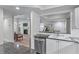Modern kitchen featuring a stainless steel dishwasher and views into the living and dining areas at 3636 Habersham Nw Rd # 2101, Atlanta, GA 30305