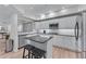 Bright kitchen features granite countertops, stainless steel appliances and a central island with seating at 3636 Habersham Nw Rd # 2101, Atlanta, GA 30305
