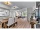 Open-concept living and dining area with hardwood floors and abundant natural light at 3636 Habersham Nw Rd # 2101, Atlanta, GA 30305