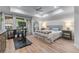 Bright bedroom with a tray ceiling, large windows, and ample space for a peloton bike at 3636 Habersham Nw Rd # 2101, Atlanta, GA 30305