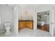 Primary bathroom featuring a double vanity, tile floors and an open view to the primary bedroom at 4740 Union Hill Rd, Canton, GA 30115
