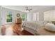 Bright bedroom with hardwood floors, large windows, and neutral decor at 4740 Union Hill Rd, Canton, GA 30115