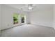 This large bedroom boasts carpeting and two windows for plenty of natural light at 4740 Union Hill Rd, Canton, GA 30115