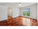 Cozy bedroom with hardwood floors, ceiling fan, and natural light at 4740 Union Hill Rd, Canton, GA 30115