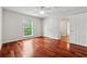 Bright bedroom features hardwood floors, closet, ceiling fan, and a view of the outdoors at 4740 Union Hill Rd, Canton, GA 30115