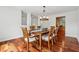 Elegant dining area with hardwood floors, classic furniture, and views to kitchen at 4740 Union Hill Rd, Canton, GA 30115