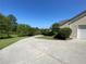 Long driveway leads to a charming house with a well-manicured lawn and landscaping at 4740 Union Hill Rd, Canton, GA 30115