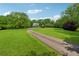 Long driveway leading to a charming home surrounded by lush greenery at 4740 Union Hill Rd, Canton, GA 30115