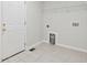 Bright laundry room with tile floor, utility connections and exterior door at 4740 Union Hill Rd, Canton, GA 30115