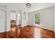 Open-concept living room features hardwood floors, natural light, and an adjacent dining area at 4740 Union Hill Rd, Canton, GA 30115