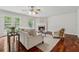 Bright living room featuring hardwood floors, a fireplace, and access to the outdoors at 4740 Union Hill Rd, Canton, GA 30115