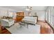Spacious living room featuring hardwood floors, ample seating, and an open view to the kitchen at 4740 Union Hill Rd, Canton, GA 30115