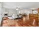 Open-concept living space featuring hardwood floors, fireplace, and seamless flow to dining area at 4740 Union Hill Rd, Canton, GA 30115