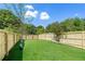 Spacious backyard featuring a well-maintained lawn and a secure wooden fence at 585 Ira Sw St, Atlanta, GA 30312