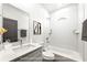 Elegant bathroom with white subway tiles, a modern vanity, and a shower-tub combination at 585 Ira Sw St, Atlanta, GA 30312