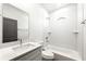 Bathroom features white subway tile, dark door, updated fixtures, and a modern vanity at 585 Ira Sw St, Atlanta, GA 30312