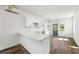 Bright kitchen featuring white cabinets, hardwood floors and modern countertops at 585 Ira Sw St, Atlanta, GA 30312