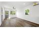 A bright and spacious living area featuring hardwood floors, large windows, and a modern design at 585 Ira Sw St, Atlanta, GA 30312