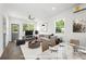 Bright living room with modern furniture, hardwood floors and abundant natural light at 585 Ira Sw St, Atlanta, GA 30312