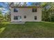 The home features a spacious backyard with a concrete patio and level lawn at 60 Whispering Pine Ct, Covington, GA 30016