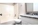 Bathroom with shower-tub combo, granite counters, and under-sink storage at 60 Whispering Pine Ct, Covington, GA 30016