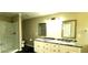 Bathroom with dual sinks, granite countertops, and a stand up shower at 60 Whispering Pine Ct, Covington, GA 30016