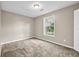 Cozy bedroom with neutral colors and carpeted floors at 60 Whispering Pine Ct, Covington, GA 30016