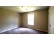 Bedroom with a window and built in closet at 60 Whispering Pine Ct, Covington, GA 30016