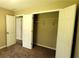 A bedroom closet door is wide open and reveals a shelf and hanging bar at 60 Whispering Pine Ct, Covington, GA 30016