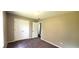 Cozy bedroom features neutral walls, carpet flooring, and a closet with bi-fold doors at 60 Whispering Pine Ct, Covington, GA 30016