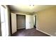 Comfortable bedroom features neutral paint, carpet flooring, and closet with bi-fold doors at 60 Whispering Pine Ct, Covington, GA 30016