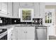 Updated kitchen featuring stainless steel appliances, granite countertops, and stylish backsplash at 60 Whispering Pine Ct, Covington, GA 30016