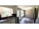 Updated kitchen with black backsplash, stainless appliances, and granite countertops at 60 Whispering Pine Ct, Covington, GA 30016