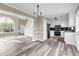 Open floor plan combining bright living room with kitchen at 60 Whispering Pine Ct, Covington, GA 30016