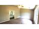 Spacious main bedroom with carpet floors and an ensuite bathroom at 60 Whispering Pine Ct, Covington, GA 30016