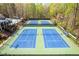 Aerial view of four tennis courts, pool and community pavilion at 815 Lake Forest Pass, Roswell, GA 30076