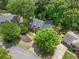 Aerial view of home with a well-maintained yard, mature trees, and neighborhood context at 815 Lake Forest Pass, Roswell, GA 30076